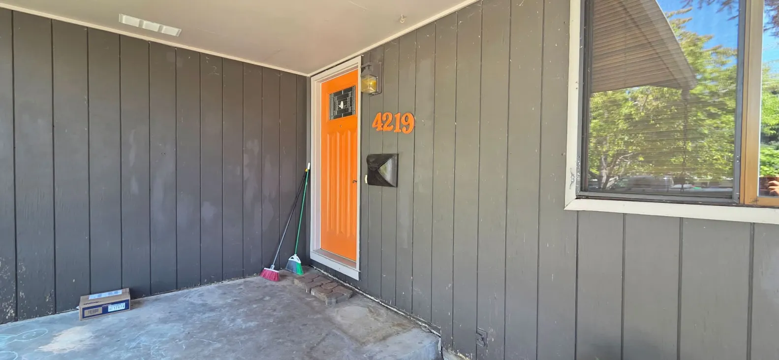 Front porch and entry before siding and trim renovation