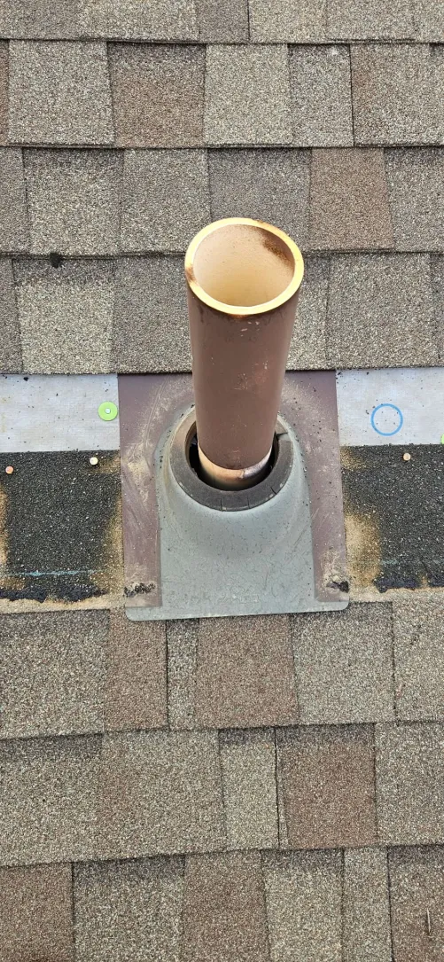 Vent pipe with new lead jacket flashing after repair